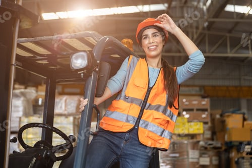 Preview: Happy woman worker warehouse staff forklift driver happy smiling enjoy working Asian people.
