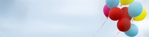 Preview: Banner 4x1 for social networks and websites bunch colorful balloons against background gray sky