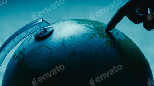 Preview: Fnger pointing on globe