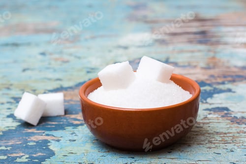Preview: Sugar granulated and refined sugar in a bowl on a wooden table