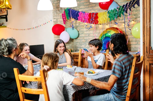 Preview: Happy family celebrating birthday at home
