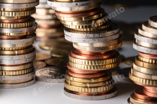 Preview: Closeup shot of piled-up euro coins in different denominations