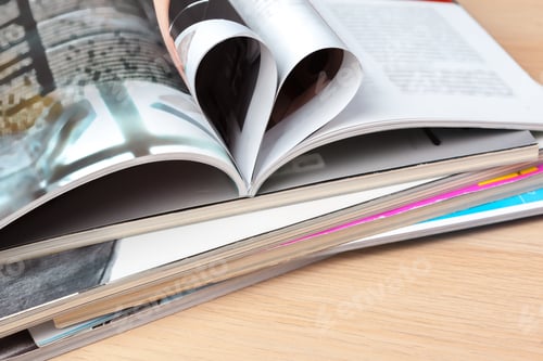 Preview: Pages of book curved into a heart shape, close up