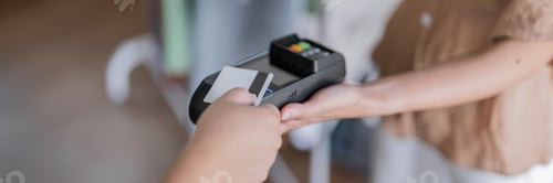 Preview: Contactless payment holding credit card with touch settlement paying