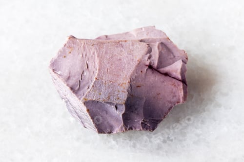 Preview: sample of raw purple mookaite mineral on white