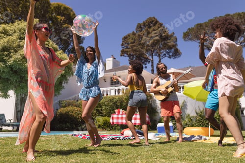 Preview: Diverse group of friends dancing and smiling at a pool party