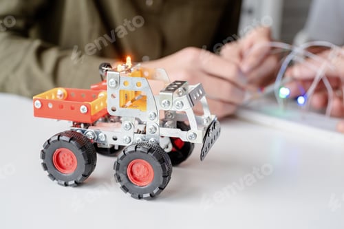 Preview: Young boys having fun constructing robot cars at the workshop
