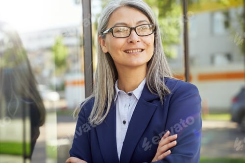 Preview: Professional Woman Smiles, Wearing Glasses and Business Suit