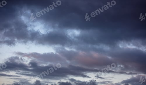 Preview: Dramatic magical sunrise cloudscape over blue gray color cloudy sky