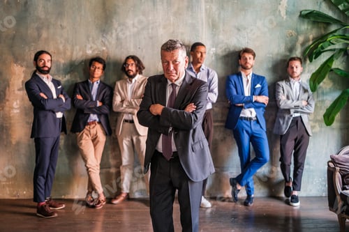 Preview: The manager of the company empowered with his young managers behind him supporting him