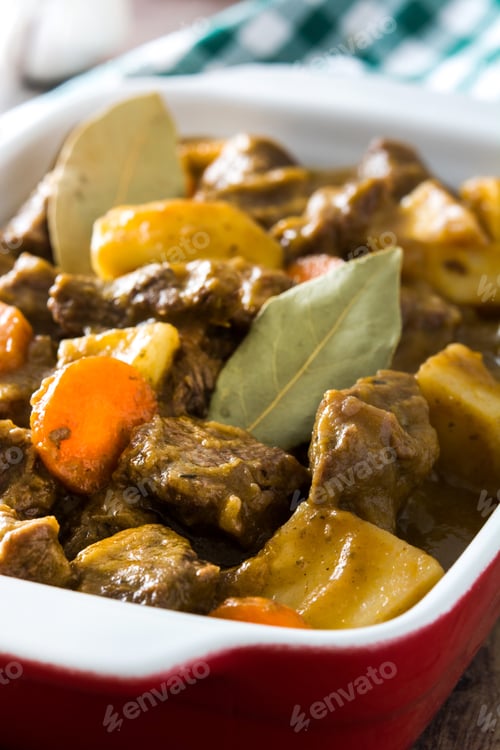 Preview: Delicious beef stew simmering with potatoes, carrots, and bay leaves