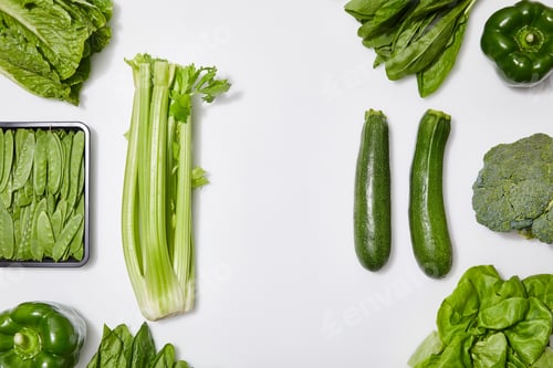 Preview: top view of green organic vegetables on white background