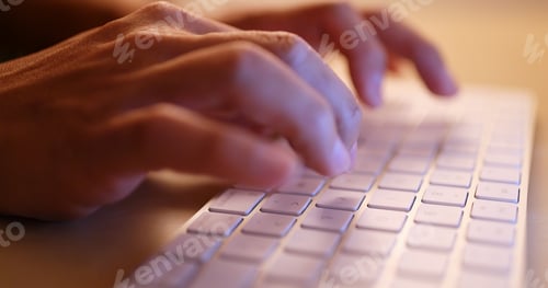 Preview: Typing on laptop computer