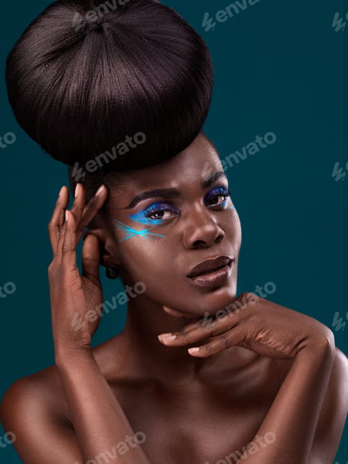 Preview: Makeup is pure magic. Studio portrait of a beautiful young woman posing against a dark background.