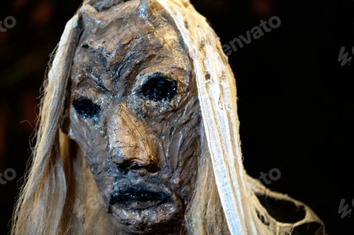 Preview: Close-up of witch face on a dark halloween horror night background