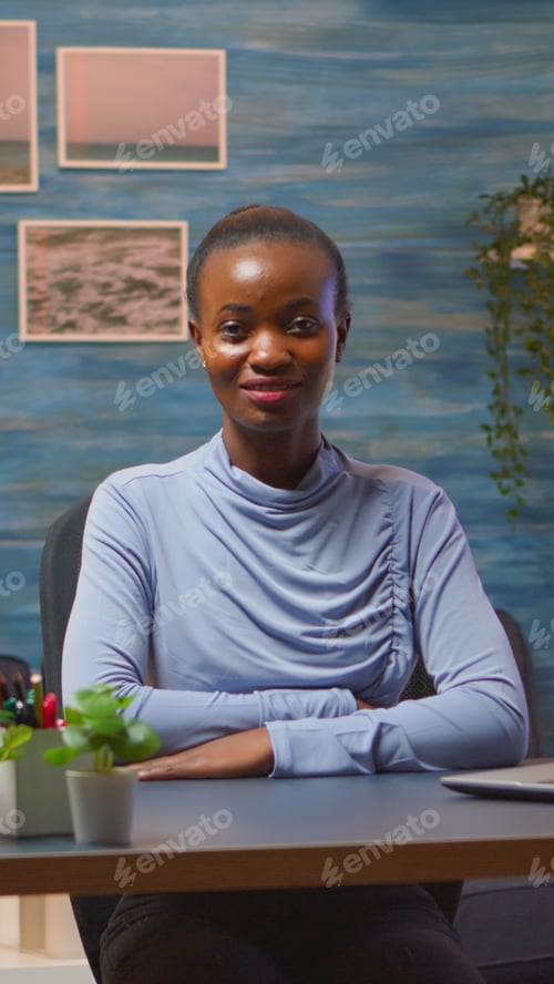 Preview: Black woman looking at camera smiling