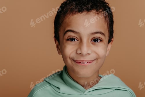 Preview: Portrait of little boy with black hair, studio shoot.