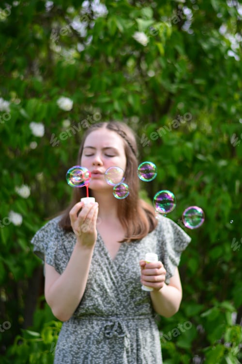 Preview: Girl blowing bubbles
