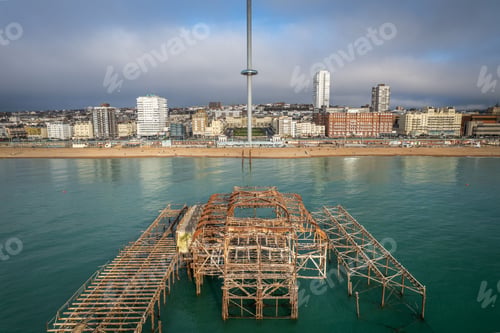 Preview: Remains of the West Pier against Brighton cityscape. England, United Kingdom.