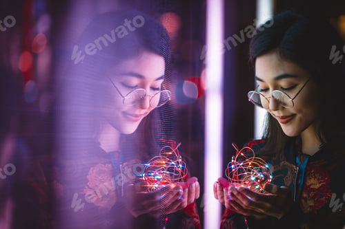 Preview: Pretty asian woman portrait with led lights
