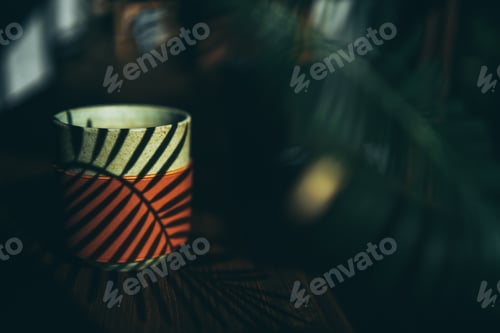 Preview: plant decoration design in minimal style background, cup of drink on natural wood table