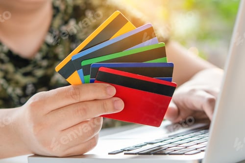 Preview: Credit card payment. Woman hands holding credit card and using laptop. Online shopping