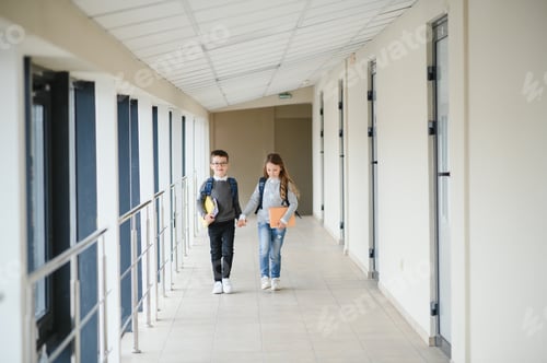 Preview: Cute pupils running down the hall at the elementary school