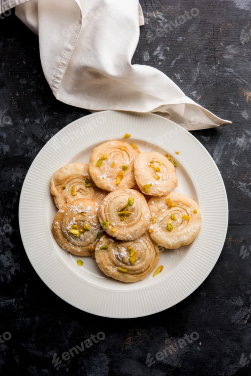 Delectable Sweet Satha or Chakri on a White Plate