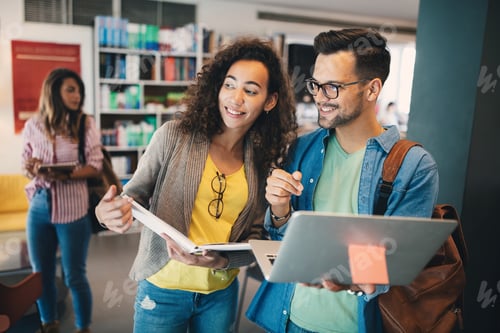 Preview: Group of college students studying in the school library