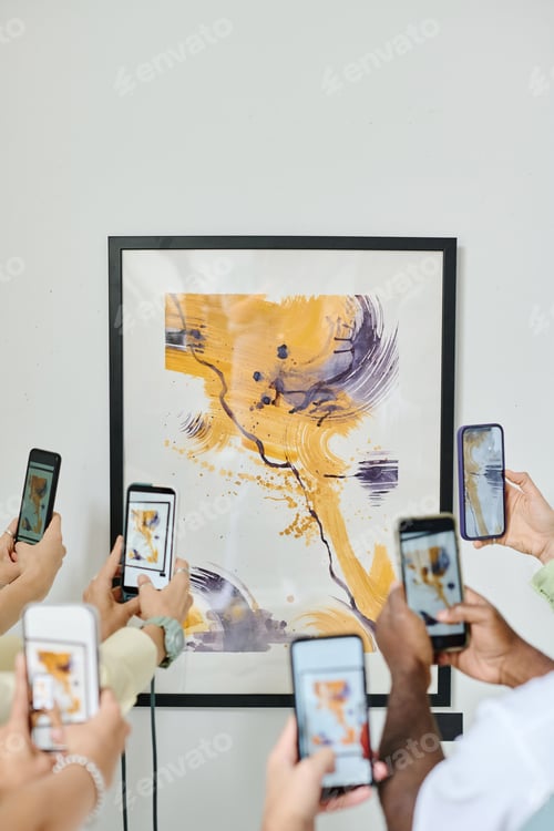 Preview: People photographing modern art at gallery