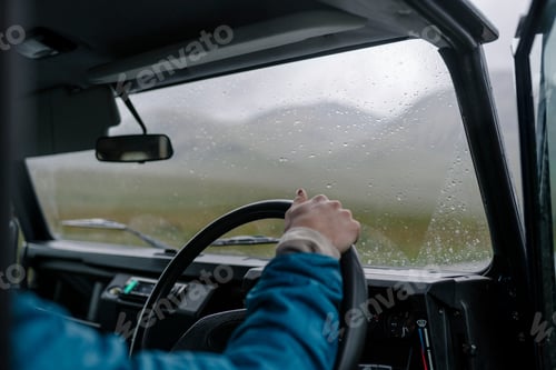 Preview: Man driving an old SUV in the Highlands