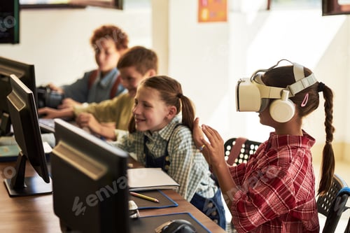 Preview: Preteen Caucasian Girl Using Virtual Reality Headset in Classroom Setting