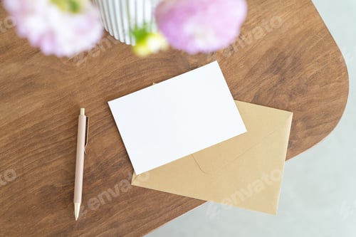 Preview: Blank Card and Envelope on Wooden Table