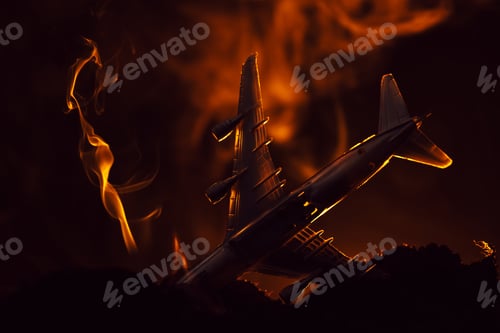 Preview: Crash of toy plane with smoke on black background, battle scene