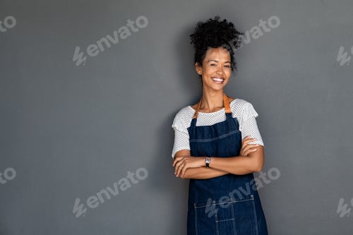 Preview: Successful business african woman looking at camera