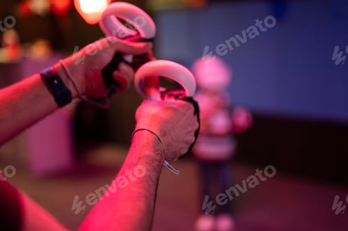 Preview: vr game and virtual reality. man gamer with joysticks playing on shooting simulation video game