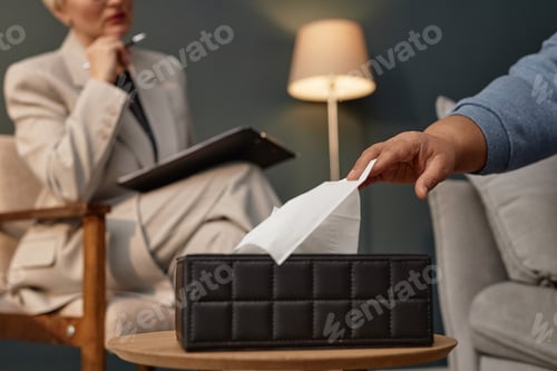 Preview: African American Woman Taking Tissue during Therapy Session