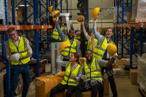 Preview: Cheerful logistics workers in a large distribution warehouse.