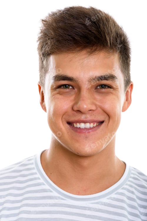 Preview: Face of young happy man smiling while looking at camera