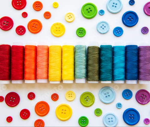 Preview: Spools of thread and buttons on the colors of the rainbow