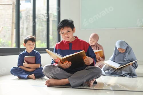 Preview: Group of Muslim children reading Koran and learning about Islam