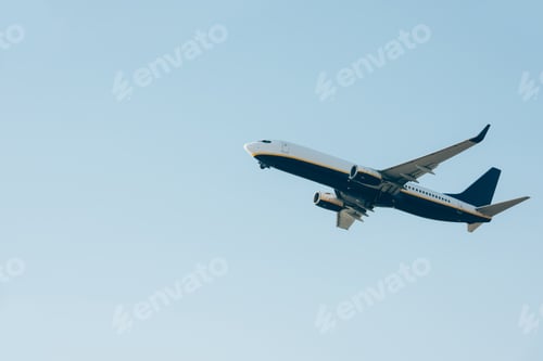 Preview: Low angle view of airplane landing in clear sky