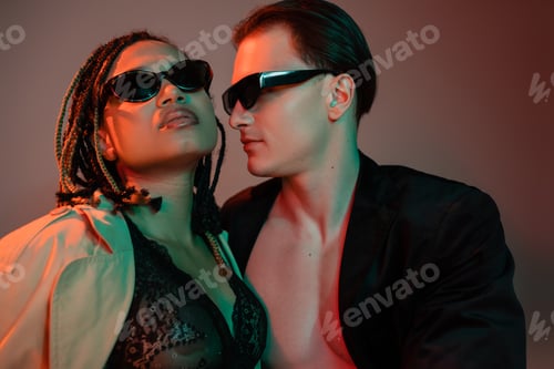 Preview: sexy interracial couple in dark sunglasses, charismatic man in black blazer and african american