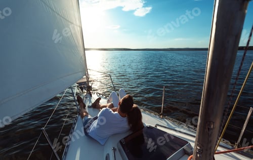 Preview: Couple Relaxing On Yacht Lying On Deck Outdoor, Back View