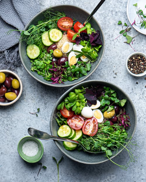 Preview: Two bowls of fresh green salad, top view