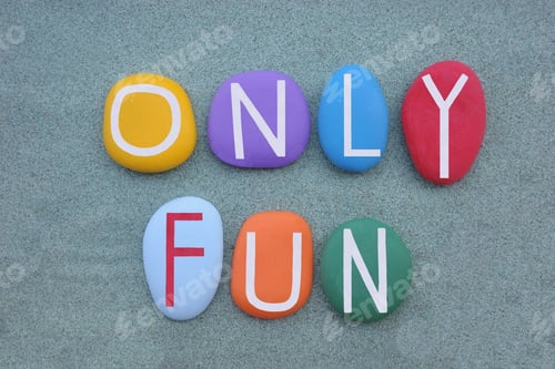 Preview: Only Fun, creative slogan composed with multi colored stone letters over green sand