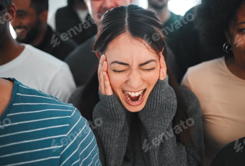 Preview: Shot of a young woman experiencing mental illness while being surrounded by people inside