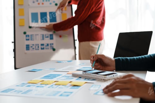 Preview: Designer, programmers, developers of mobile applications work together to invent a modern mobile