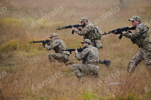 Preview: A disciplined and specialized military unit, donned in camouflage, strategically patrolling and