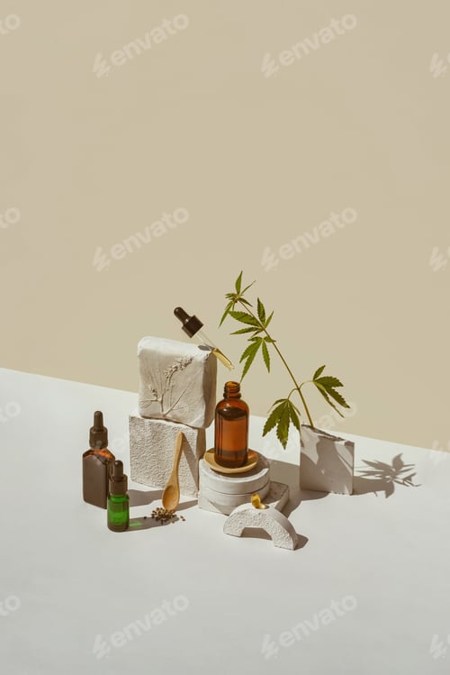 Preview: Various glass bottles with CBD oil, tincture and hemp leaves, capsules with hypos geometric shapes